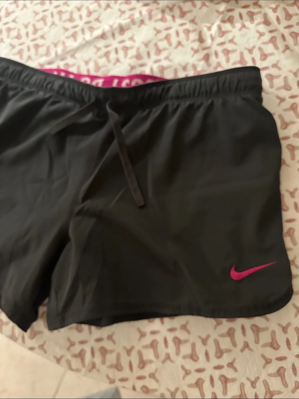 Nike Women’s Black Athletic Shorts with built in pink under shorts.